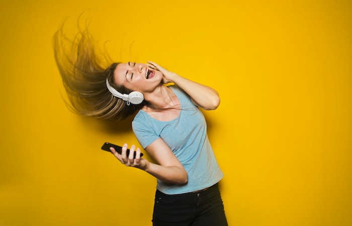 girl dancing with headphones on