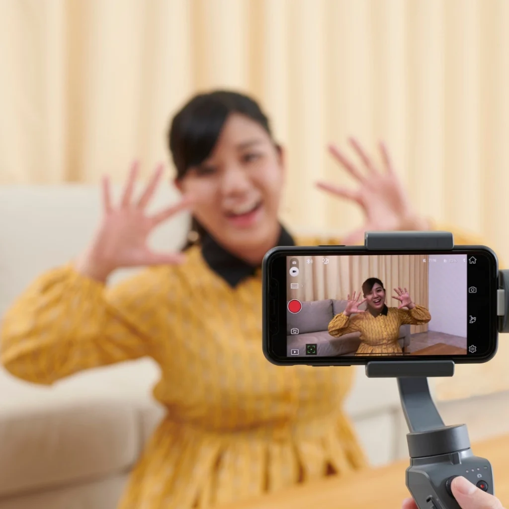 Marketing team filming short-form video content for social media platforms.