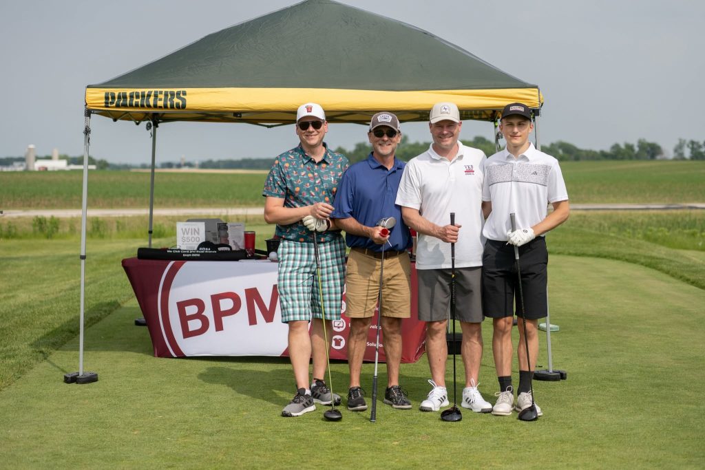 Golfers at the first hole of our inaugural outing.
